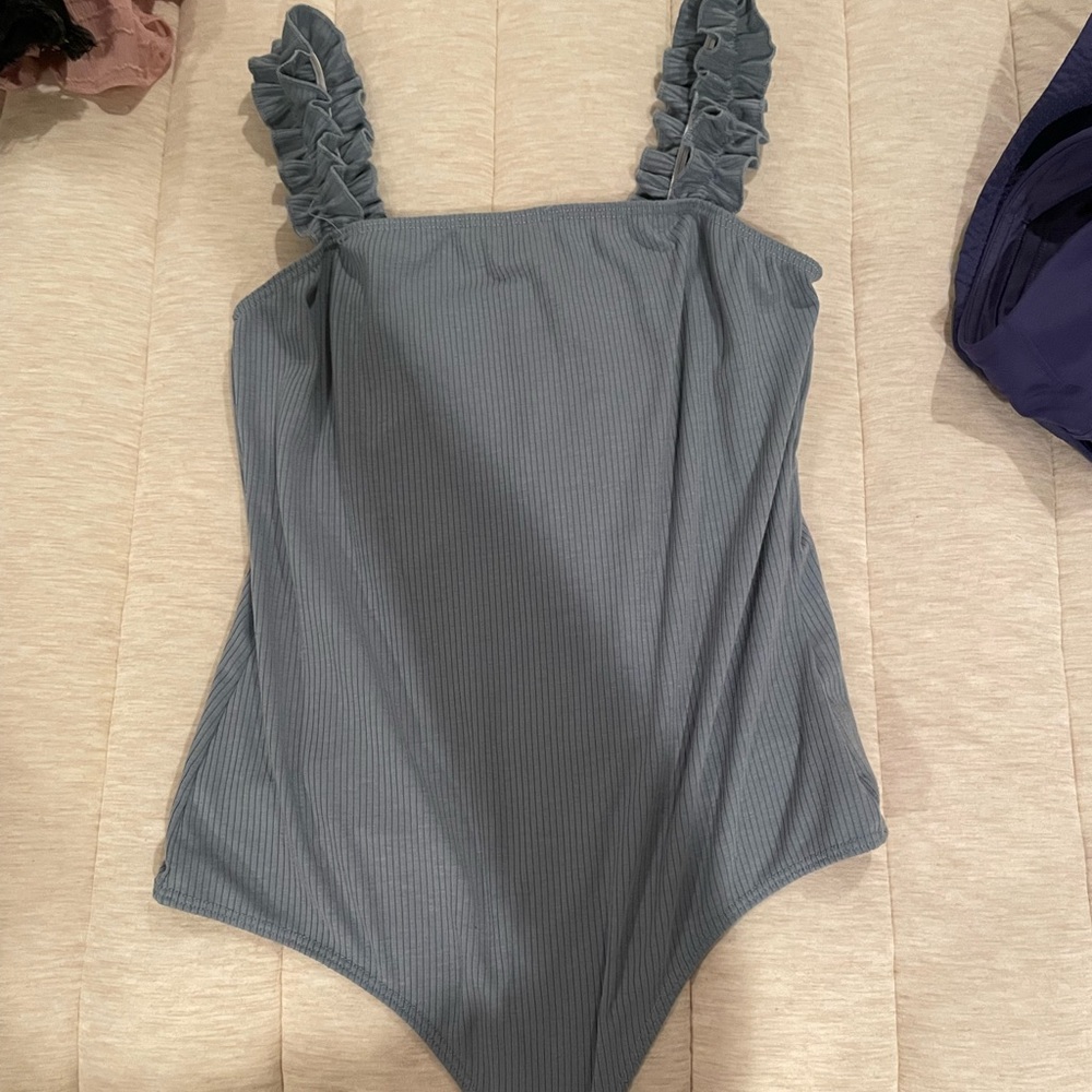 blue bodysuit